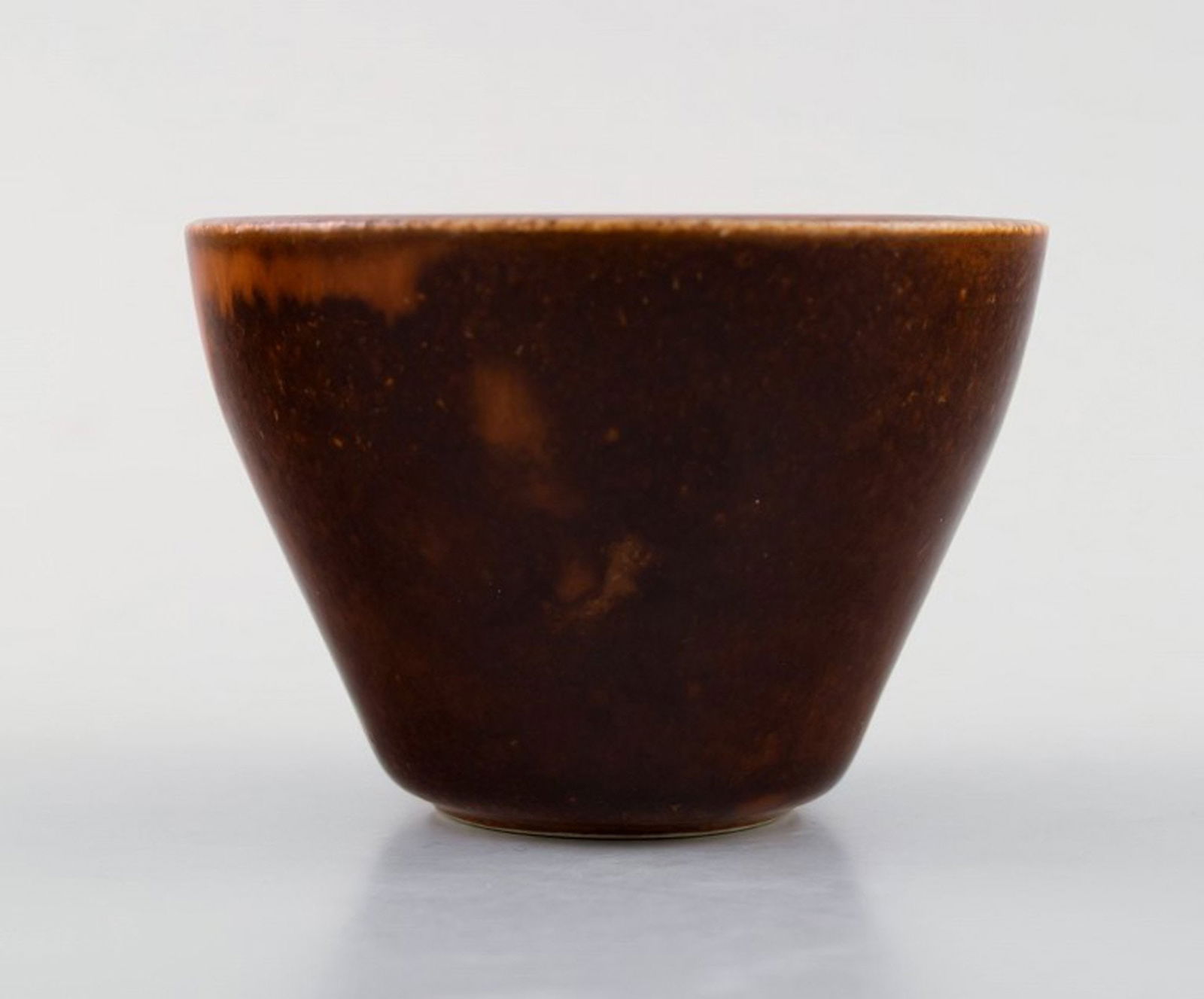 Saxbo stoneware vase in modern design, glaze in brown shades.: Saxbo stoneware vase in modern design, glaze in brown shades. Stamped Saxbo. Ying Yang. Measures 7 x 5 cm. In perfect condition. Reserve: $189.00 Shipping: Domestic: Shipping rates are determined by d
