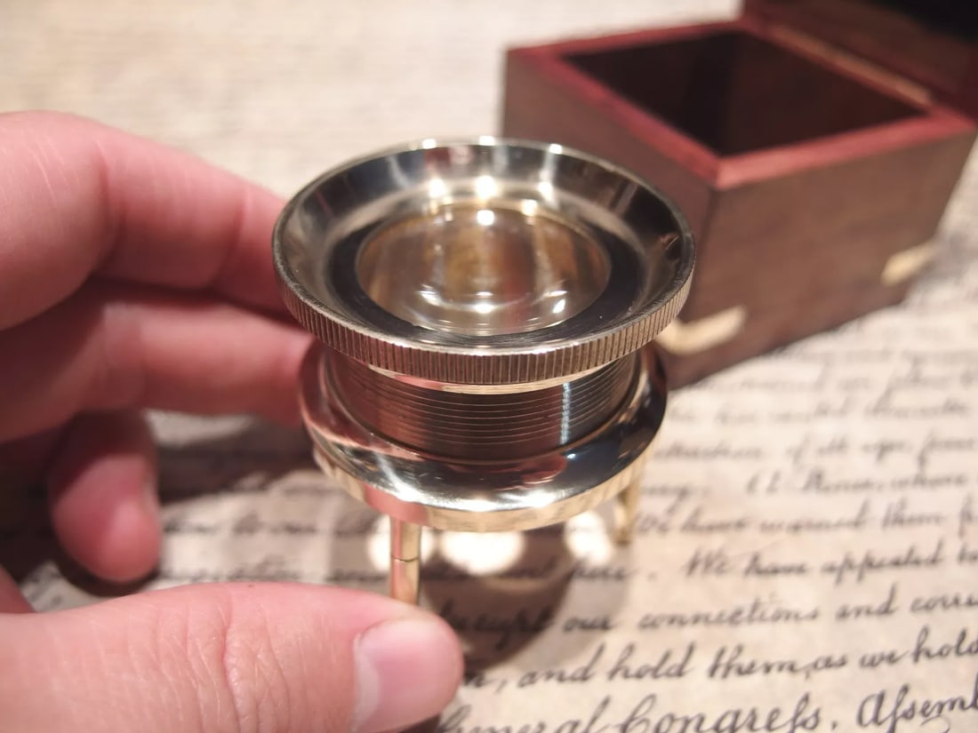 Brass Chart Map Glass Magnifying Desk Lens Magnifier w Box: Glass is 1 7/8" Wide x 2" High,.. adjustable to 2 1/2" box is 2 3/4" x 2 3/4" x 2 3/4" Nice reproduction of an antique magnifying lens. Nice heavy quality thick glass. This piece slides along the surf