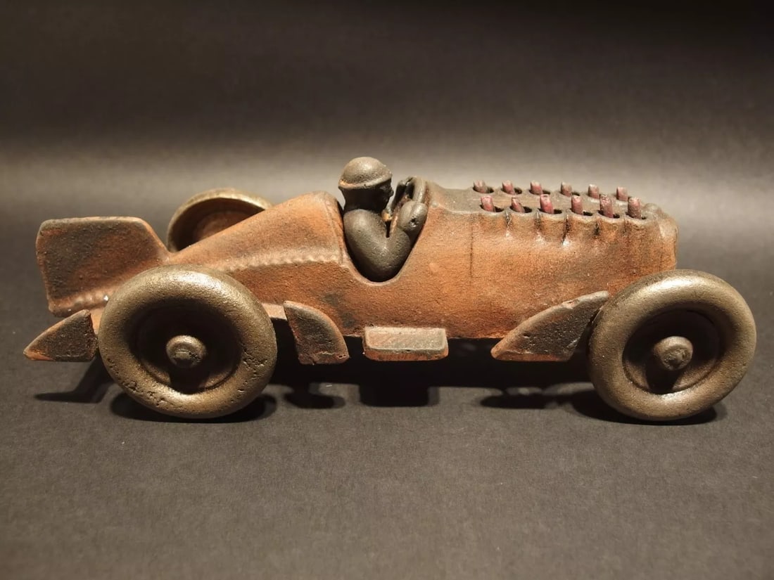 Cast Iron Toy Race Car w Moving Pistons "Hubley": 10 1/4" Long x 3 1/2" Wide 4" Tall 2 lbs 13 oz Such a neat reproduction cast iron car! As you can see this heavy cast iron car was wonderfully hand painted and distressed to look original. The car is 