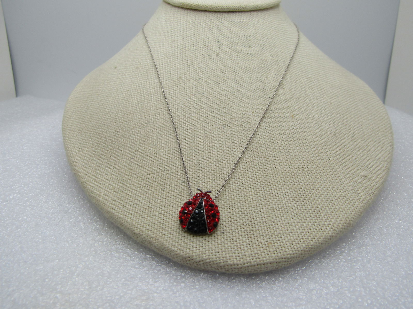 Vintage Sterling Rhinestone Ladybug Necklace, 18": Vintage Sterling Rhinestone Ladybug Necklace, 18". Signed SAi and marked .925 and tests as sterling with a weight of appx. 2.16 gr. The chain is an appx. 1mm wide rope style chain with spring clasp an