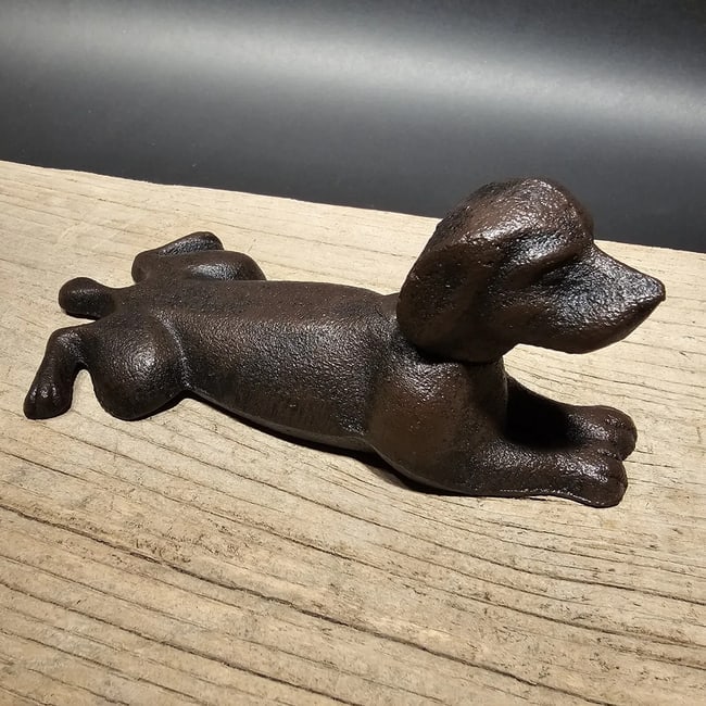 Cast Iron Dog Door Stop Wedge Rust/Black: 6" Long x 3 1/2" WideNice Reproduction antique solid cast iron rust/black dog door wedge. This dog is much thicker, and heavier then other similar ones we have seen. Please see the images, this item i
