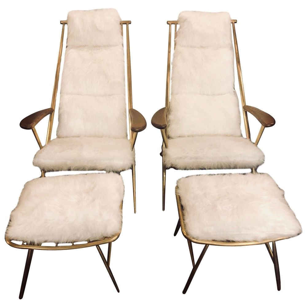 Pair of Hollywood Regency Style Shearling Lounge or Chaise Chairs and Ottomans: Pair of Hollywood Regency style shearling style lounge chairs each having a matching ottoman. The pair made of a gilt metal that is strong and sturdy with ladder form having overstuffed cushions that