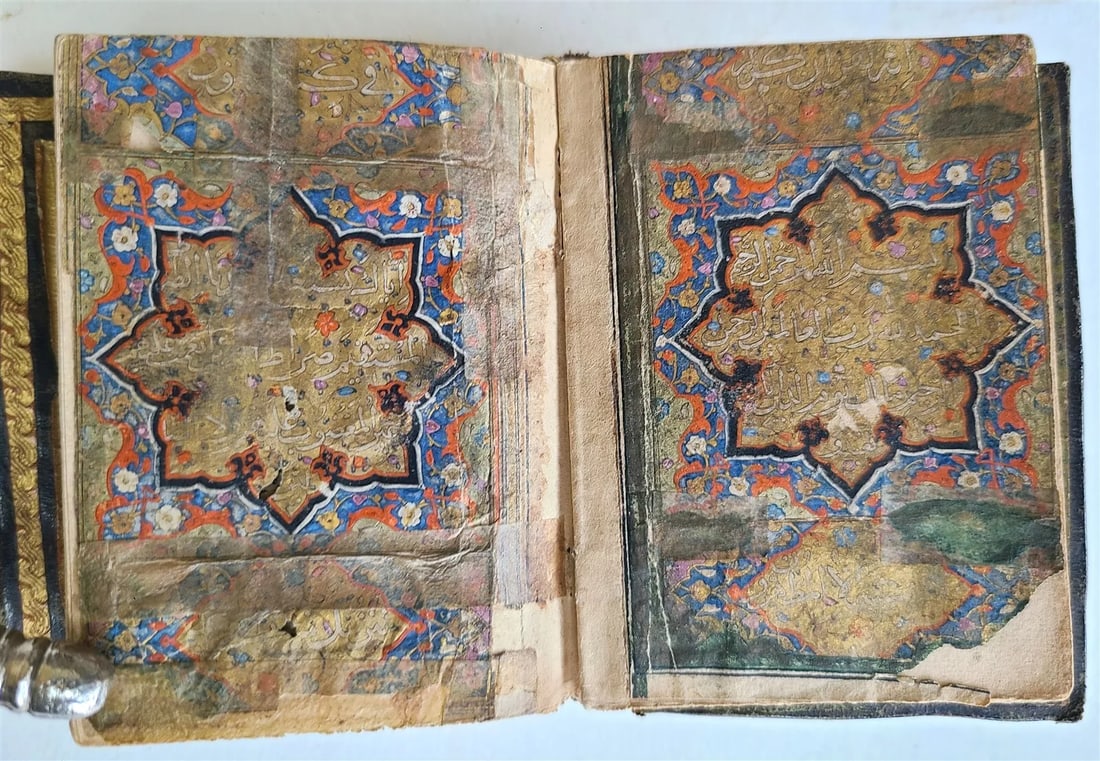 early 19th CENTURY MANUSCRIPT KORAN ISLAMIC antique ILLUMINATED small QURAN: Arabic manuscript Koran 19th century probably Persian black ink on paper, wide gold bars, sentence separation by gold dots, type area regularly illustrated with floral ornaments, some with hand annota