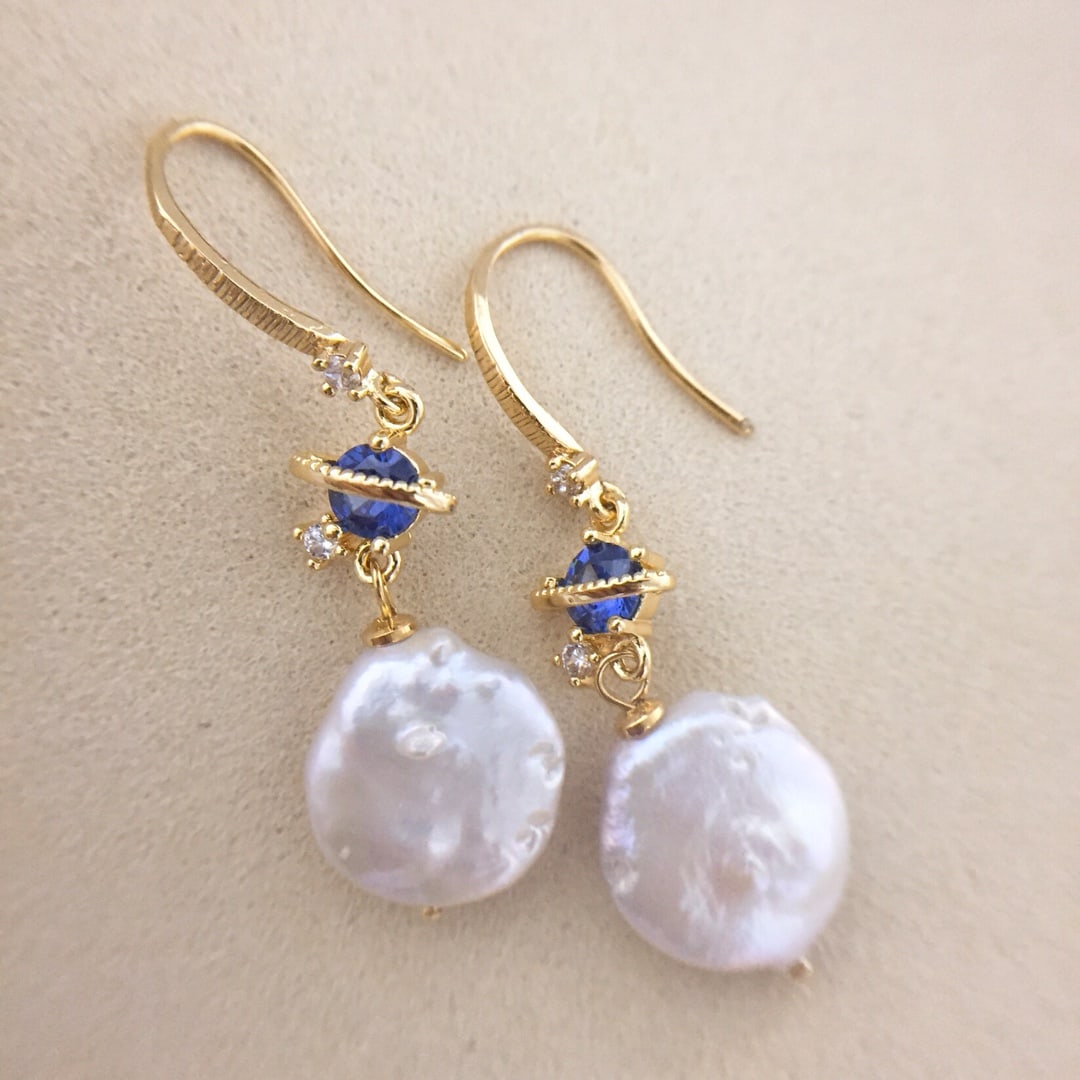 Natural star baroque pearl earrings: Natural star baroque pearl earrings. Natural bright baroque freshwater pearls. Handmade Reserve: $50.00 Shipping: Domestic: Shipping rates are determined by destination International: Foreign shipping