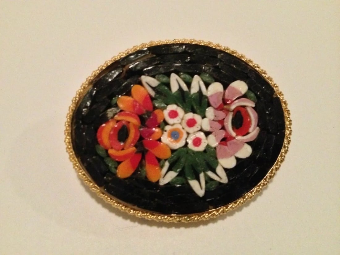 Italian Mosaic Brooch with Vibrant Floral Motif: Title: Italian Mosaic Brooch with Vibrant Floral Motif Description: Vintage mosaic, which is from the 1960's. It is made of fine pieces in vibrant shades of pink, yellow, orange, green upon a deep blu