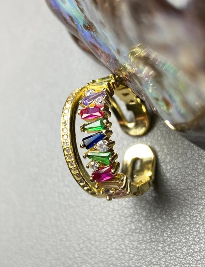 Yellow gold plated multi colour topaz ring: Title: Yellow gold plated multi colour topaz ring Description: Indulge in opulent radiance with our captivating Yellow Gold Plated Statement Ring, adorned with ten vibrant, multicolored lab-created to