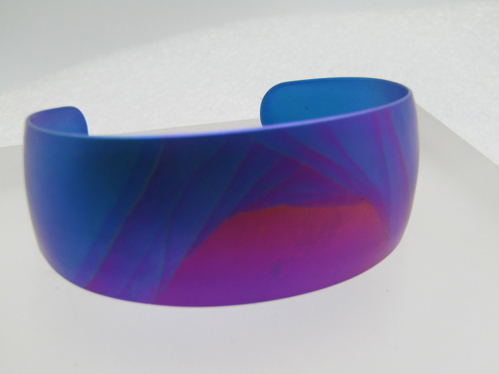 Kenneth Reid Titanium Cuff Bracelet, Purple, Pink, Teal, Magenta, 6.75": Kenneth Reid Titanium Cuff Bracelet, Purple, Pink, Teal, Magenta. This has an inside measurement of 675 with a 1.25 " with 1.25" of that being the opening ion the back. Easy to slip on. I have a 7.25"