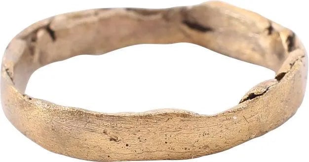 CRUSADER'S WEDDING RING, SIZE 9: Forged bronze, size 9 with considerable lamination of the metal evident. About 4.0mm width. The surface with hammer finish. A peasant ring, village made with the limited resources available. Found in