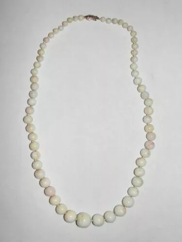 Angel Skin Coral Graduated Bead Necklace: Title: Angel Skin Coral Graduated Bead Necklace Description: Gorgeous classic angel skin coral necklace. Lovely graduation and recently restrung on white silk, hand knotted to keep these lovely off wh
