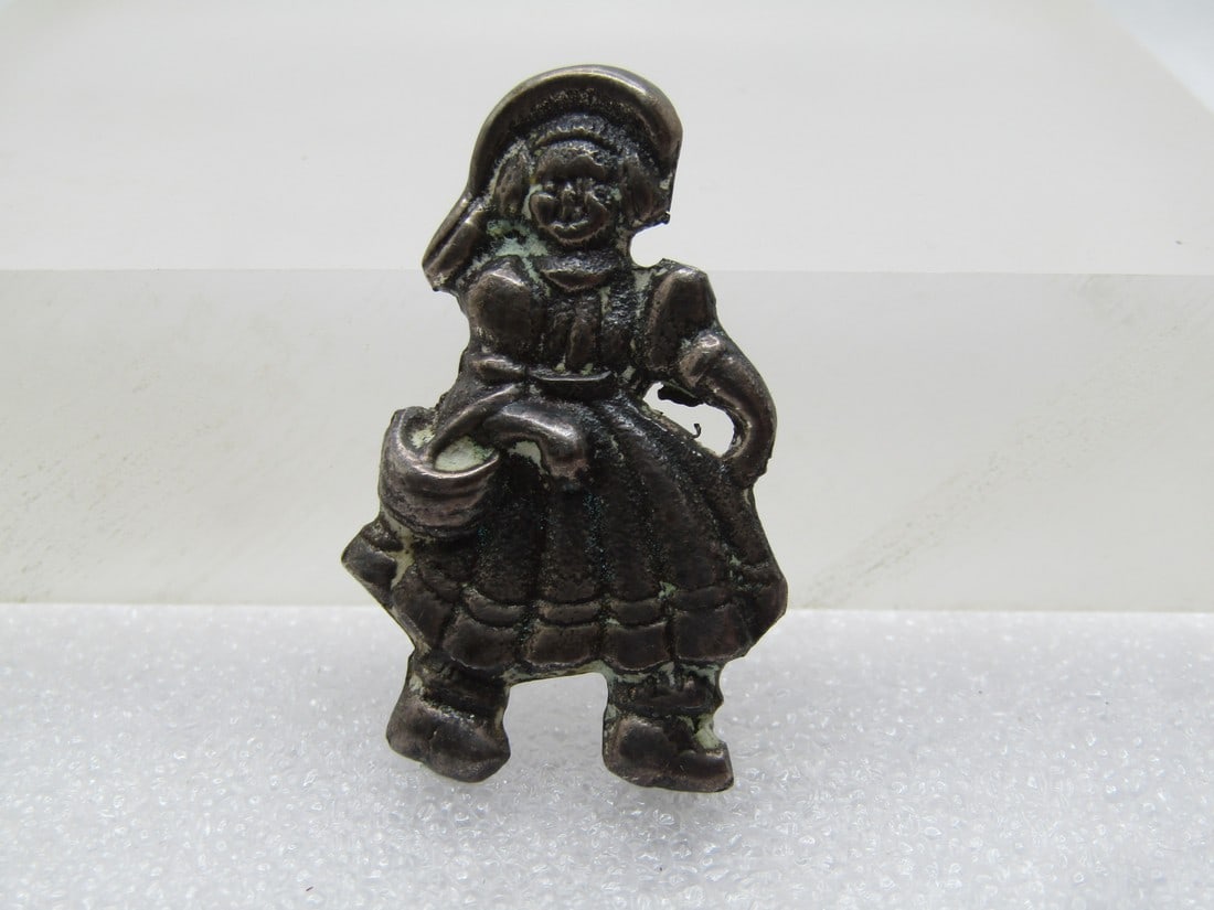Vintage Sterling Dutch Girl Brooch, 1940's-1950's: Vintage Sterling Dutch Girl Brooch, 1940's-1950's. Marked Ster and tests as sterling with an appx. weight of 8.96 gr. The pin is appx. 1-5/8" tall and 1" wide. The little dutch girl is carrying a bask
