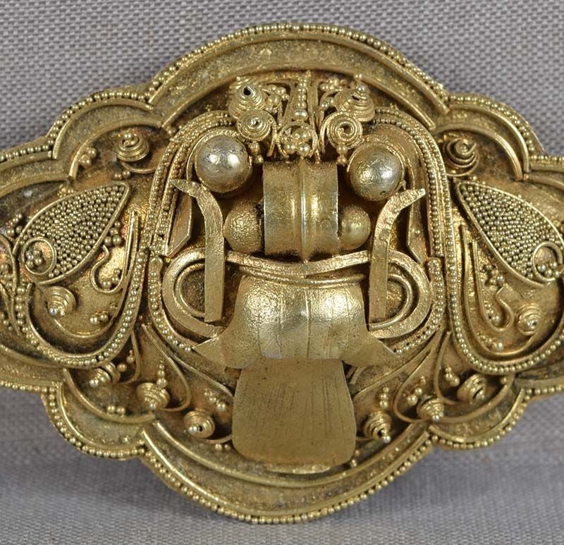 19c Tibetan silver BROOCH/ PIN YAMA Lord of Death: Late 19th century Tibetan brooch / pin depicting a face of a monster with bulging eyes, long fangs and tongue stuck out. The image is probably that of Yama - the Lord of Death. I did not check the met