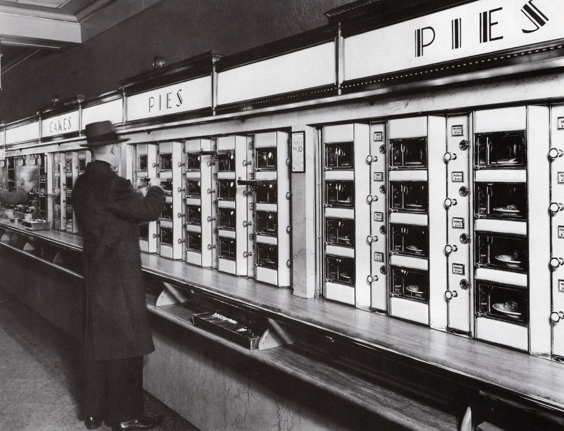 BERENICE ABBOTT - Automat, 977 Eighth Ave.: Artist: BERENICE ABBOT Print Title: Automat, 977 Eighth Ave. Printing Date: 1980s Medium:Duotone Photolithograph Printed in: Japan Image Size approx: 6.5 x 8.5” Berenice Abbott (1898 – 199