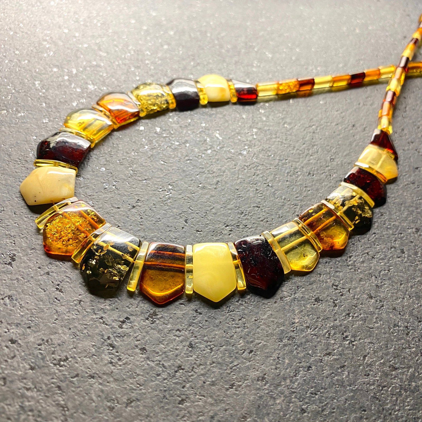 Astonishing Amber Cleopatra necklace: Title: Astonishing Amber Cleopatra necklace Metal:None Gemstone: Amber Weight :16.45 g Size:Size: 450.0 x 20.0 x 5.0 mm Size: 17.717 x 0.787 x 0.197 inches Made of: (Reconstituted Amber or Whole Stone