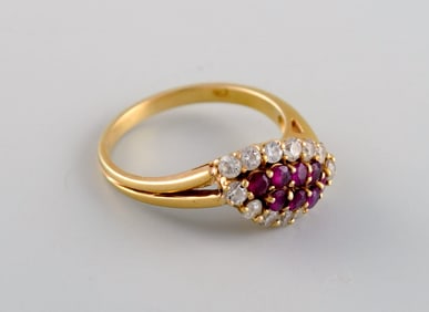 Scandinavian jeweler. Ring in 18 carat gold adorned with diamonds and purple stones. Mid-20th