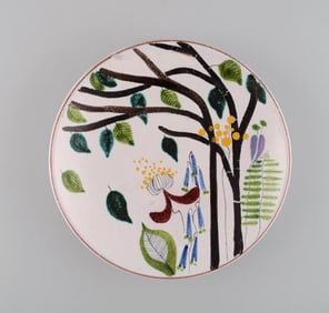 Stig Lindberg for Gustavsberg Studiohand. Round dish in glazed faience with hand-painted flowers.