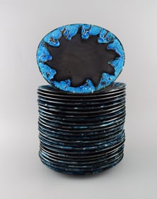 French ceramist. 24 dinner plates in glazed stoneware. Beautiful glaze in azure shades. Unique,