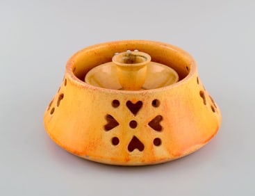 Kähler, Denmark. Candlestick with heater in glazed stoneware. Beautiful orange uranium glaze.