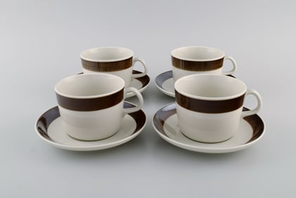 Hertha Bengtsson (1917-1993) for Rörstrand. Four Koka teacups with saucers in glazed stoneware.