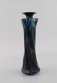 European studio ceramicist. Unique vase in glazed stoneware. Turned shape. Beautiful glaze in deep