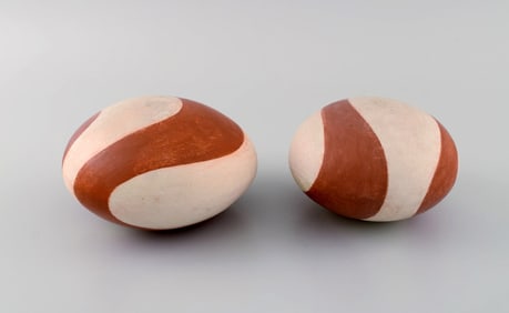 European studio ceramicist. Two rattle instruments in glazed stoneware. Hand-painted wavy decoration