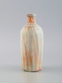 Danish studio ceramicist. Unique vase in glazed stoneware. Beautiful glaze in light and orange