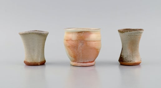 Danish studio ceramicist. Three unique vases in glazed stoneware. Beautiful glazes in peach and