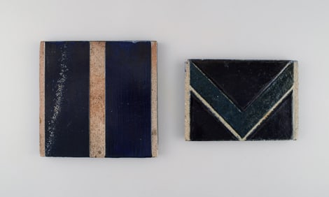 Danish studio ceramicist. Two unique tiles in glazed stoneware. Patterned decoration in dark blue,