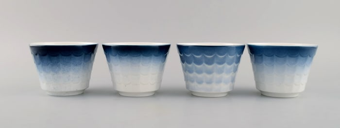 Wilhelm Kåge for Gustavsberg. Four flower pot covers in porcelain. Swedish design, 1960s.