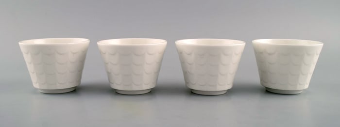Wilhelm Kåge for Gustavsberg. Four flower pot covers in porcelain. Swedish design, 1960s.