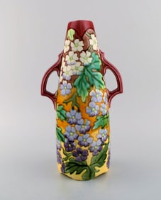 Large antique art nouveau vase with handles in glazed ceramics. Hand-painted flowers and foliage on