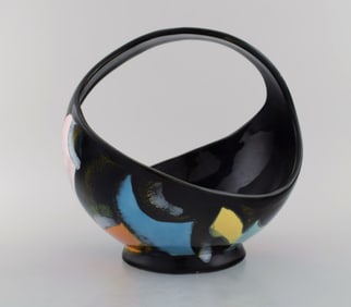 Longwy, France. Equinoxe basket in glazed ceramics. Abstract polychrome decoration on black