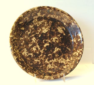 Antique pie plate with brown sponge decoration