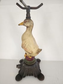 A VERY NICE CAST IRON DUCK SPRINKLER