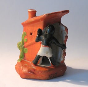 Antique bisque outhouse paper weight.