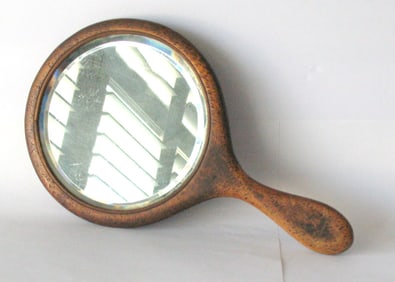 Antique beveled glass folk art painted hand mirror.