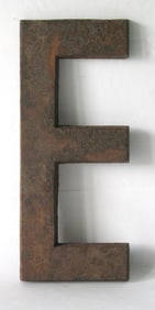 Vintage cast iron letter “E”.