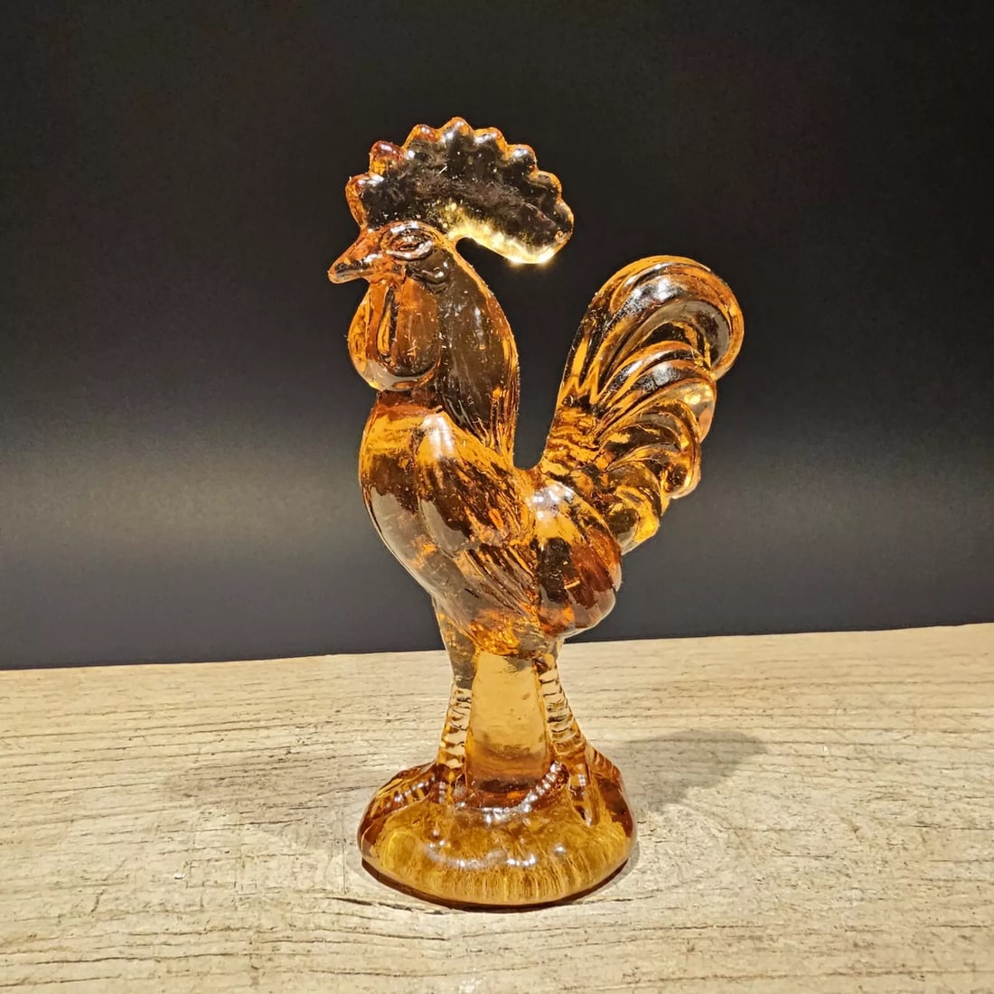 Amber Depression Glass Rooster Chicken: 4 1/2" Tall Wonderful reproduction glass rooster chicken figurine is a beautiful addition to any collection. The vibrant amber color and depression-style design make it a unique and eye-catching piece