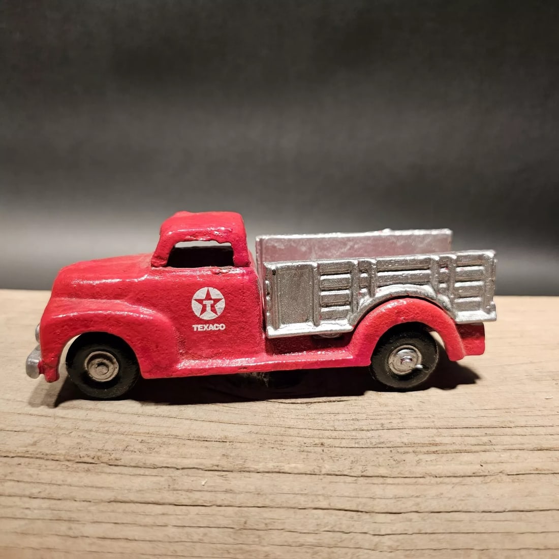 Cast Iron Red Texaco Truck Flat bed Car: 6 3/4" Long x 2 1/4" Wide 2 1/2" Tall Such a neat reproduction cast iron truck. As you can see this heavy cast iron truck was wonderfully hand painted and distressed to look original. The car is mostl