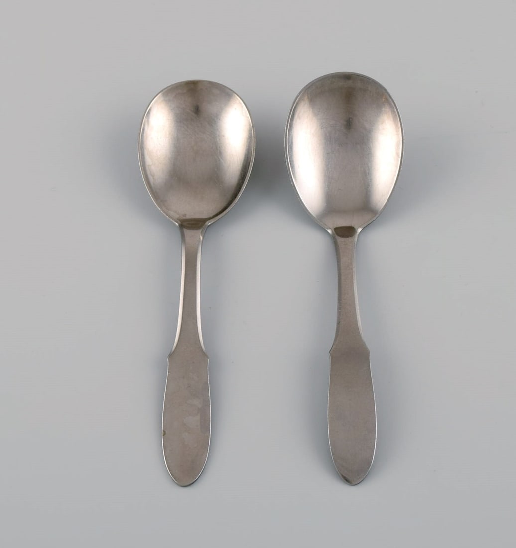 Gundorph Albertus for Georg Jensen. Two Mitra jam spoons in stainless steel. 1970s.: Title:Gundorph Albertus for Georg Jensen. Two Mitra jam spoons in stainless steel. 1970s. Description:Gundorph Albertus for Georg Jensen. Two Mitra jam spoons in stainless steel. 1970s. Length: 15.5 c