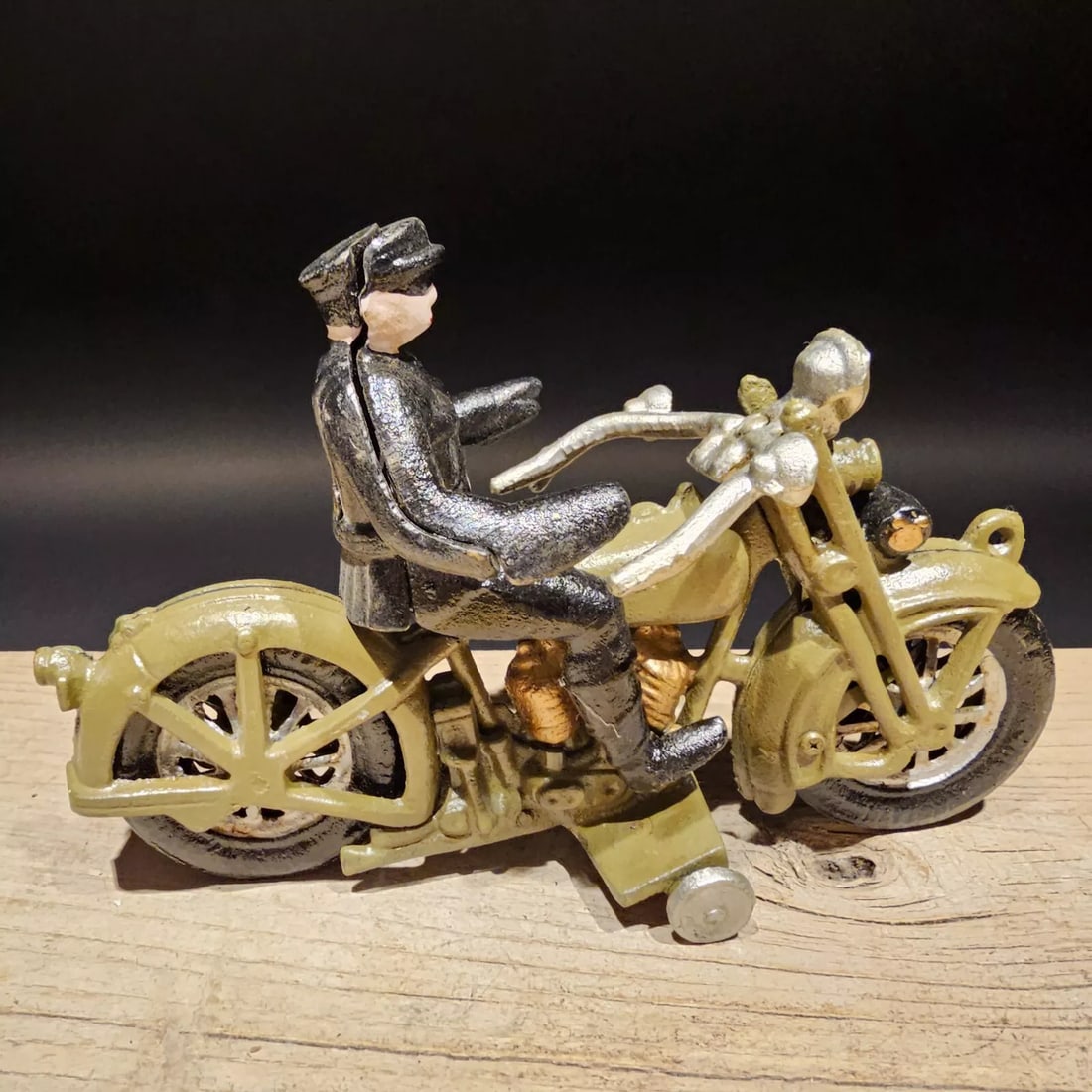 9" Cast Iron Toy Policeman Motorcycle Toy: Such a neat reproduction cast iron motorcycle! As you can see this heavy cast iron pull toy motorcycle was wonderfully hand painted and distressed to look like an original antique. Very solid piece! I