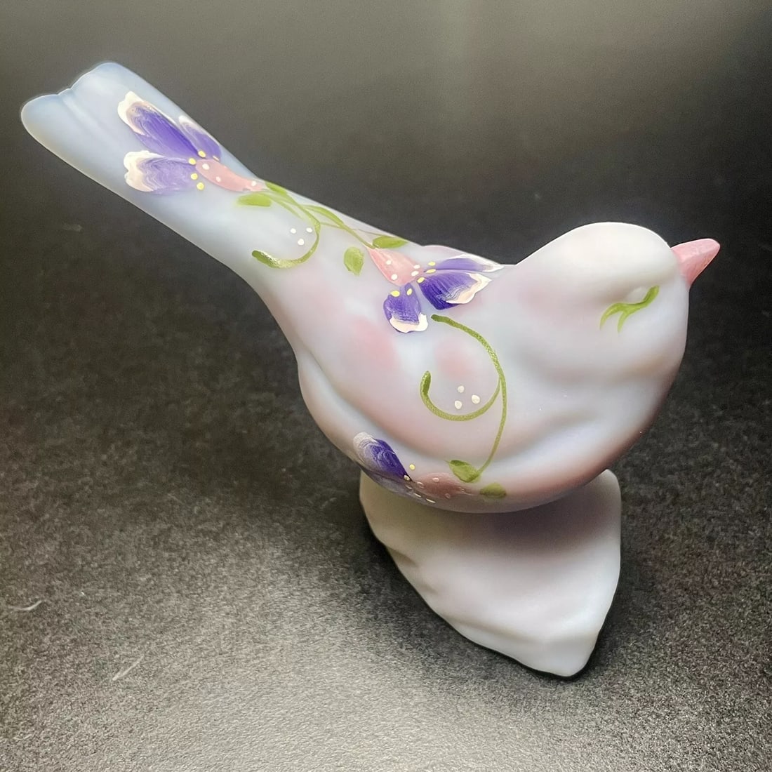 FENTON Vintage Satin Purple Floral Solid Glass Bird Figurine Signed by Fredrick: This is a vintage Fenton glass bird figurine featuring a floral pattern in a satin purple finish. The figurine is hand-painted and signed by D. Fredrick, making it a unique and collectible piece. It m