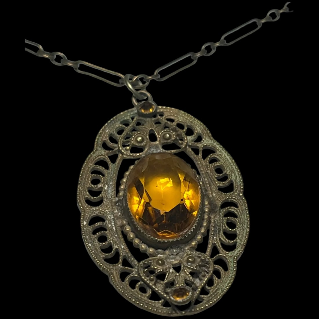 Vintage Filigree Cut Glass Amber Pendent on Decorative Chain: Title: Vintage Filigree Cut Glass Amber Pendent on Decorative Chain Description: Vintage Filigree Cut Glass Amber Pendent on Decorative Chain Metal, Cut Glass Costume Chain Measures 20 inches, Pendant