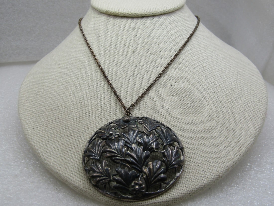 Vintage Sterling Coro Open Domed Leaf Necklace on 18" Chain: Vintage Coro Sterling Open Domed Leaf Necklace on 18" Chain, The pendant is appx. 2" across, domed with a open leaf design that is domed with three blossoms mixed in between the leaves. Age is appx. 1