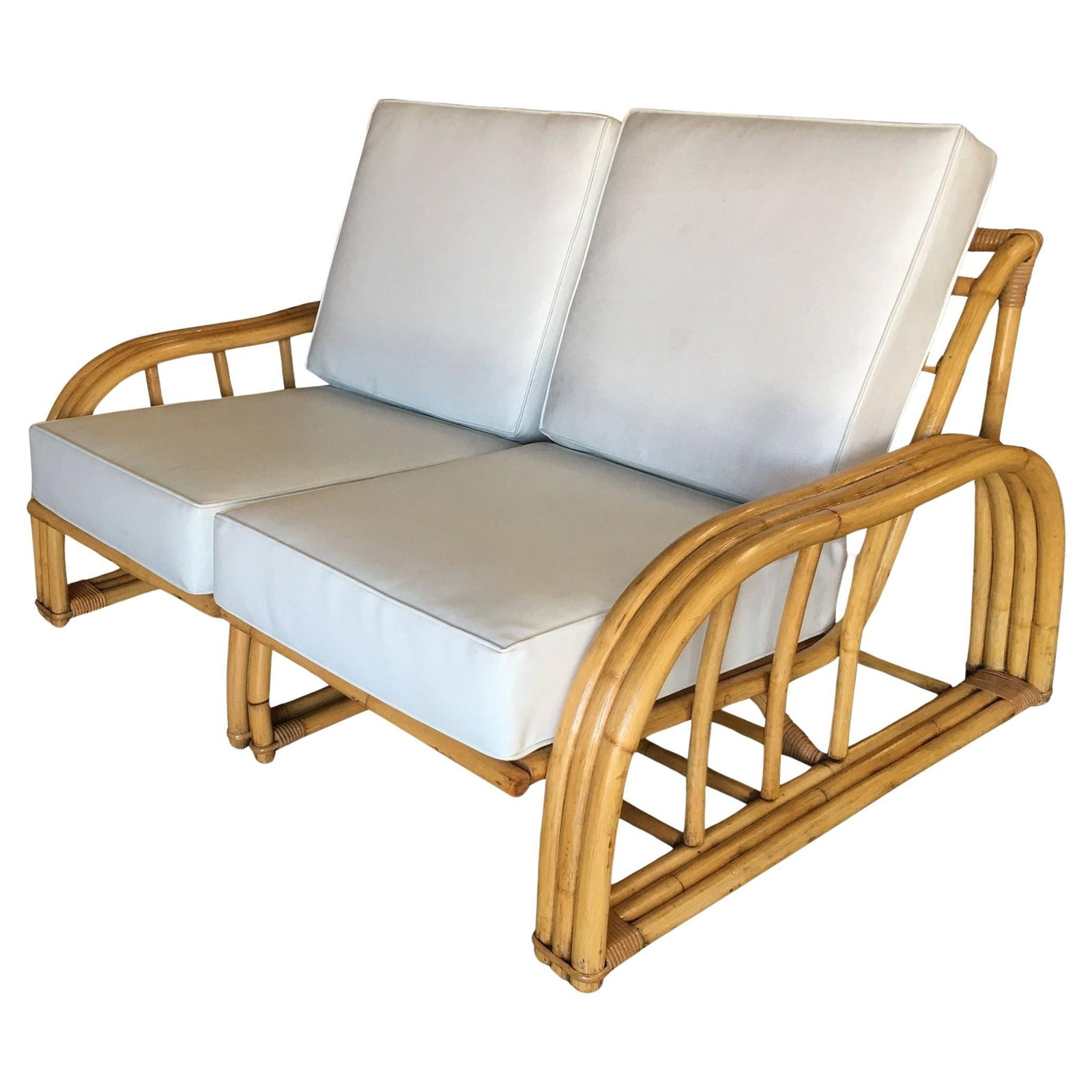Rare Restored Museum Quality Paul Laszlo Arched 3-Strand Rattan Settee: Rare museum quality Paul Laszlo three-strand rattan settee. This loveseat dates from 1941 and features a unique arched arm and lounge arched seat back. 1950, United States We only purchase and sell on