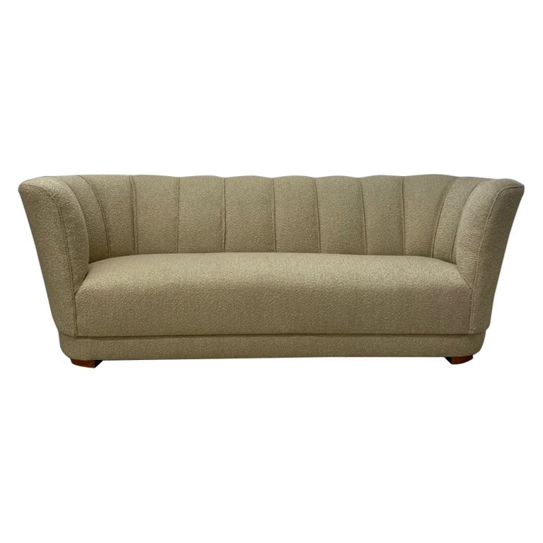 Flemming Lassen Style, Danish Mid-Century Modern, Curved Sofa, Boucle, 1940s: Flemming Lassen Style, Danish Cabinetmaker, Mid-Century Modern, Curved Sofa, Beige Boucle, 1940s Beautifly organic shaped Danish sofa similar to works by Flemming Lassen. This sofa features a newly up
