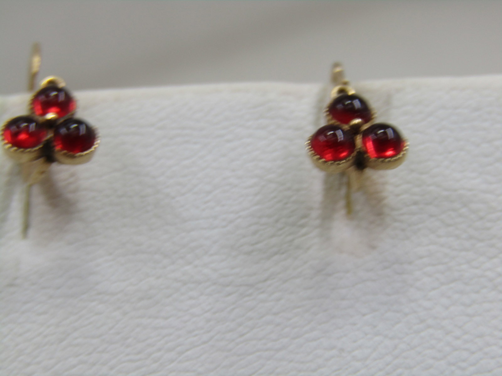 Vintage 14kt Red Stone Leverback Pierced Earrings, 5/8": Title:Vintage 14kt Red Stone Leverback Pierced Earrings, 5/8" Description:Vintage 14kt Red Stone Leverback Pierced Earrings, 5/8" long and 3/8" wide. Three round deep red stones believed to be garnets