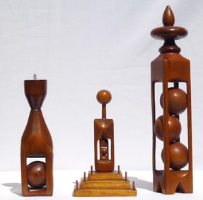 A set of three elegantly carved whimsies