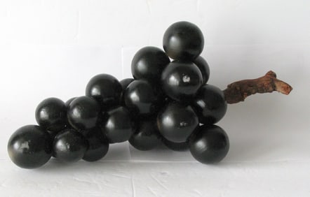 Vintage cluster of Huge stone black grapes.