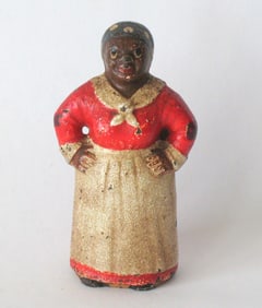 Antique cast iron Mammy paper weight.