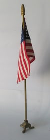 Vintage deck flag with cast iron base.